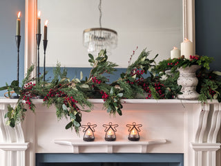 Cypress, olive and red berry garland for a staircase