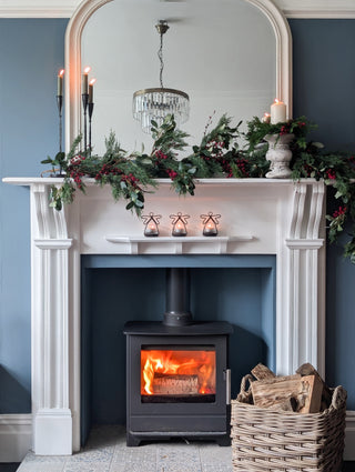 Red berry clusters on the real touch cypress and olive garland