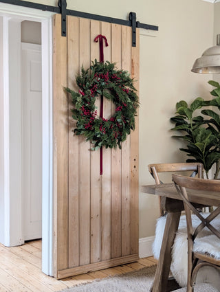 Faux olive leaf, eucalyptus and red berry wreath for a front door