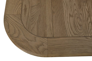 Close-up of the Ashbourne table's panelled corner, showing the inset radius detail, oak grain and weathered finish