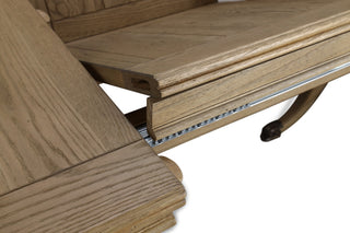 Close-up of an oak extension leaf locating onto the dowel pegs in the Ashbourne dining table top