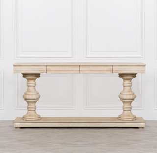 Pemberton limewashed mango wood console table front view against panelled wall
