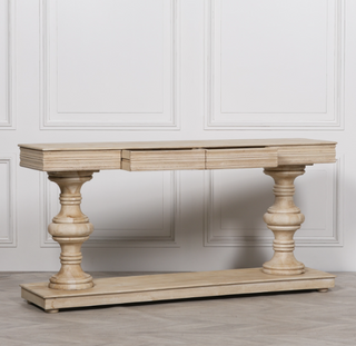 Pemberton 180cm limewashed mango wood console table with twin pedestals and two drawers, angled view