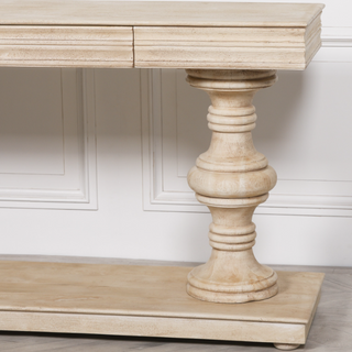 Hand-carved column pedestal leg and lower display shelf of the Pemberton mango wood console