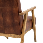 Brown leather armchair with wooden frame on a white background