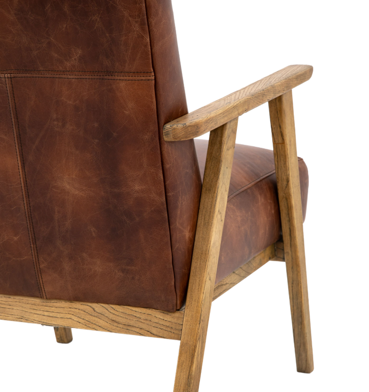 Brown leather armchair with wooden frame on a white background