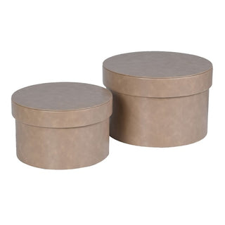 Penshurst set of two mushroom hat boxes shown side by side, with the smaller round box beside the larger, both in soft taupe faux leather finish against a white background