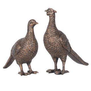 Pair of bronze effect pheasant figurines with detailed feathers