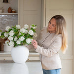 Pom Pom White Viburnum Spray. Its snowball-like floral heads and lush leaves, delicately drooping like the real thing, make for an incredibly lifelike addition to any setting. Use between 6 - 8 stems for a truly impressive impact.
