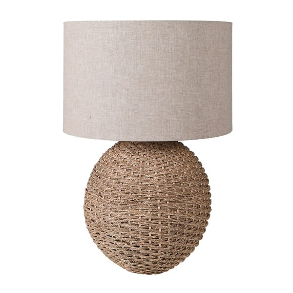 Table lamp with textured base and beige lampshade on a white background