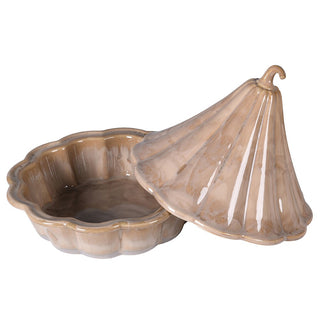 Ribbed gourd lid beside its scalloped base