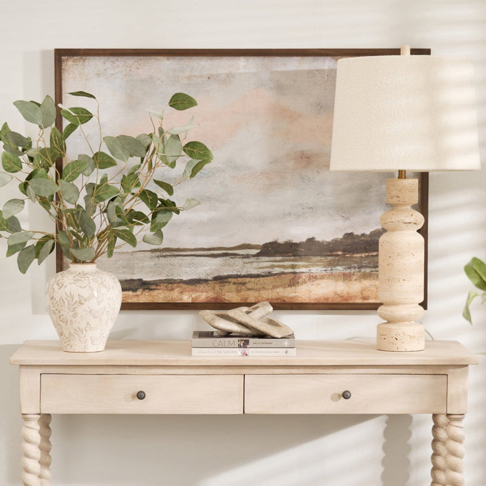 Framed riverside landscape wall art featuring a vintage-style painting with muted earth tones and soft cloudy sky, perfect for rustic or neutral home décor.