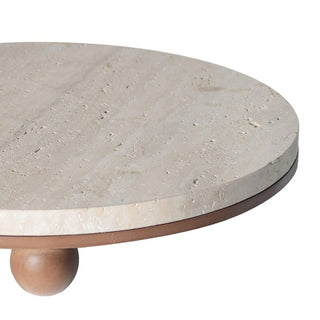 Travertine footed board in profile showing raised wooden ball feet and honey-toned stone