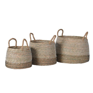Norfolk large rush basket with rounded belly silhouette, natural pale rush weave, darker bronzed band around lower third and twin looped rope handles