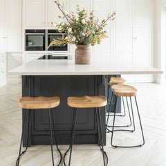 Add a touch of rustic charm and industrial flair to your space with this stylish bar stool featuring a weathered oak seat and sleek black metal legs. Designed for both comfort and durability, the contoured solid wood seat provides natural support while the sturdy metal frame ensures long-lasting use. The minimalist silhouette makes it a perfect addition to modern, farmhouse, or industrial-style kitchens, bars, or dining areas.

This wood and metal bar stool combines aesthetics with function, making it ideal