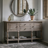 Farmhouse console table styled with mirror and decorative items