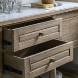 Detail view of open drawers with antique brass knobs