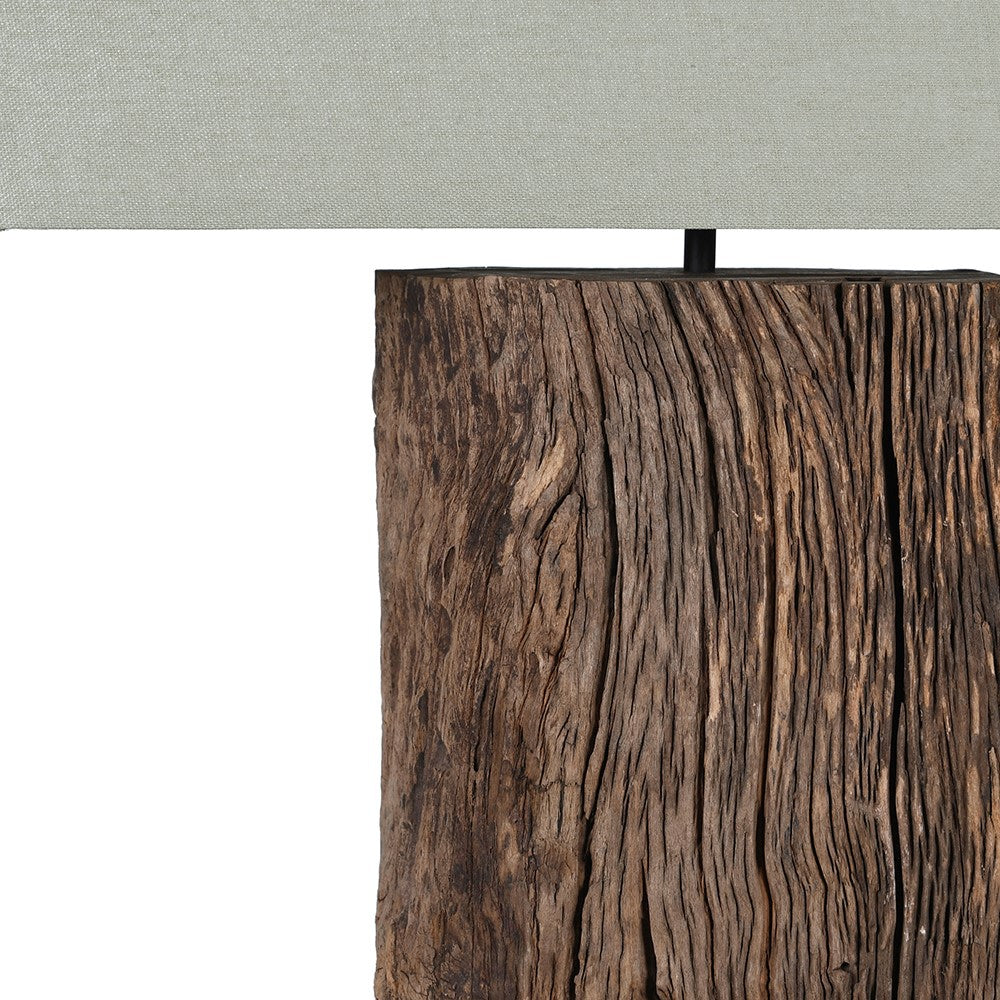Close-up of weathered reclaimed wood lamp base, showcasing natural grooves and rich wood grain detail