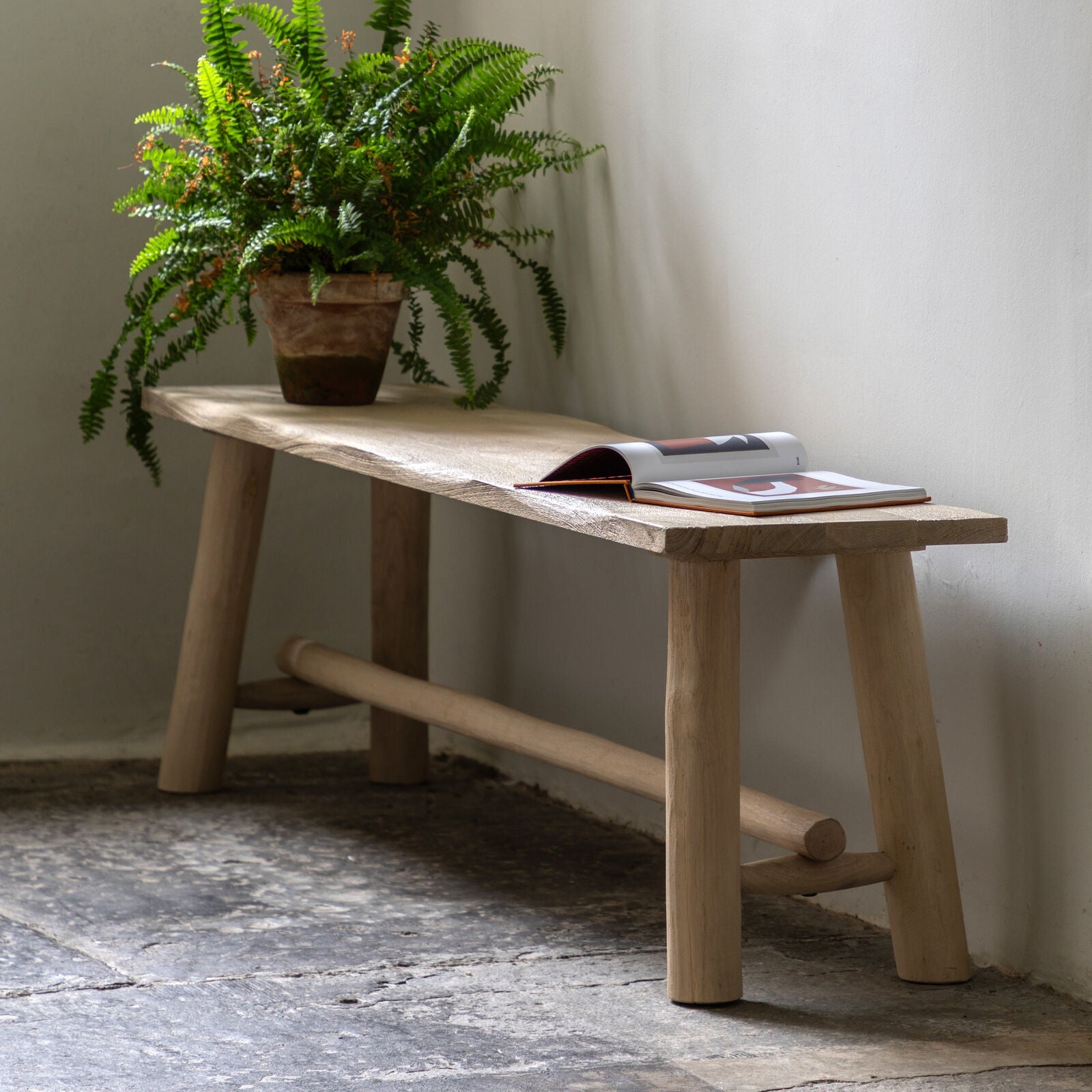 Rustic solid wood farmhouse bench with natural finish and round legs