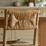 Woven chair in a kitchen setting with a neutral color palette