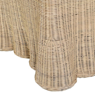 Close-up of a woven wicker or rattan chair skirt with a natural light tan colour, 