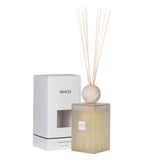 Sences diffuser with reeds and packaging on a white background