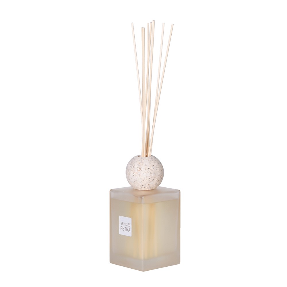Sleek SENCES Petra scent diffuser with frosted glass bottle, travertine lid, and reed sticks – stylish home fragrance decor