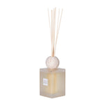 Sleek SENCES Petra scent diffuser with frosted glass bottle, travertine lid, and reed sticks – stylish home fragrance decor