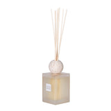 Sleek SENCES Petra scent diffuser with frosted glass bottle, travertine lid, and reed sticks – stylish home fragrance decor