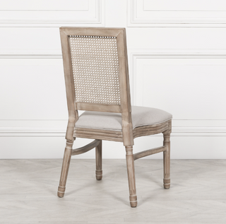 Rear view of the Salcombe dining chair showing the woven rattan cane back panel
