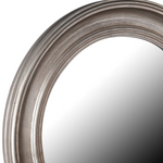 This gorgeous round mirror is complete with distressed silver detailing.