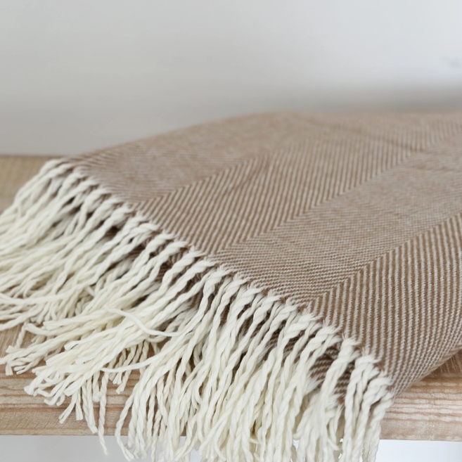Brown throw with tasseled fringe