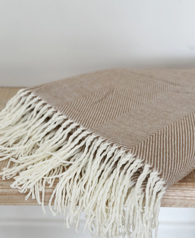 Brown throw with tasseled fringe