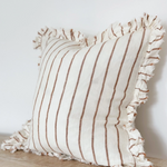 A beautiful linen cushion in cream with brown stripe running through and ruffled edges
