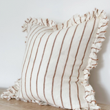 A beautiful linen cushion in cream with brown stripe running through and ruffled edges