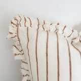 A beautiful linen cushion in cream with brown stripe running through and ruffled edges