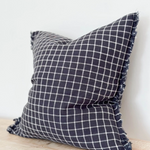 Navy Check Cushion, complete with a feather inner and adorned with a frayed edge and zip closure