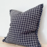Navy Check Cushion, complete with a feather inner and adorned with a frayed edge and zip closure