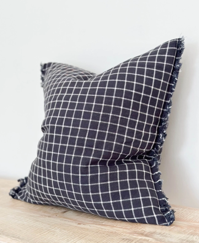 Navy Check Cushion, complete with a feather inner and adorned with a frayed edge and zip closure