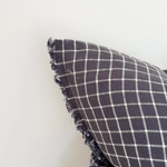 Navy Check Cushion, complete with a feather inner and adorned with a frayed edge and zip closure
