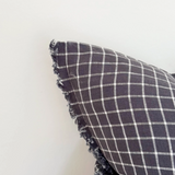 Navy Check Cushion, complete with a feather inner and adorned with a frayed edge and zip closure