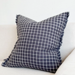 Navy Check Cushion, complete with a feather inner and adorned with a frayed edge and zip closure