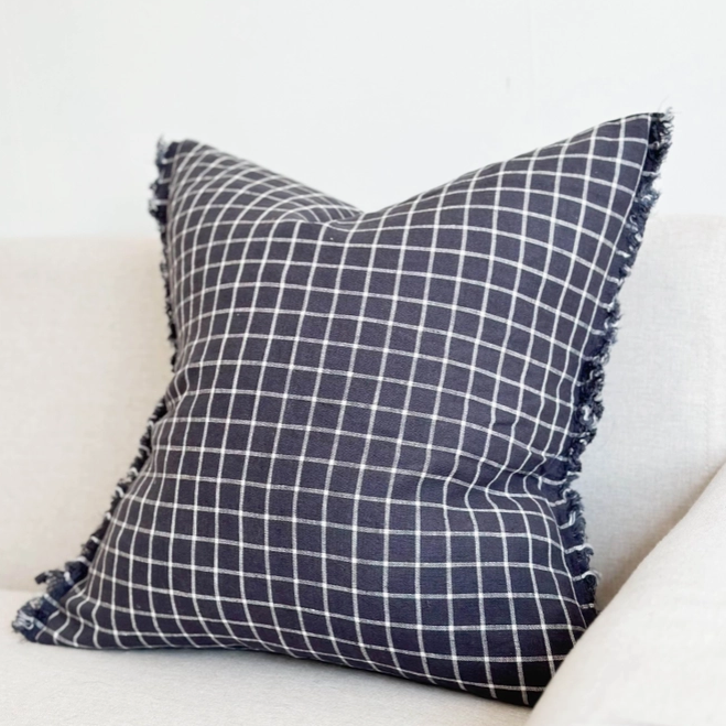 Navy Check Cushion, complete with a feather inner and adorned with a frayed edge and zip closure