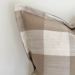 Large cushion with brown checker pattern