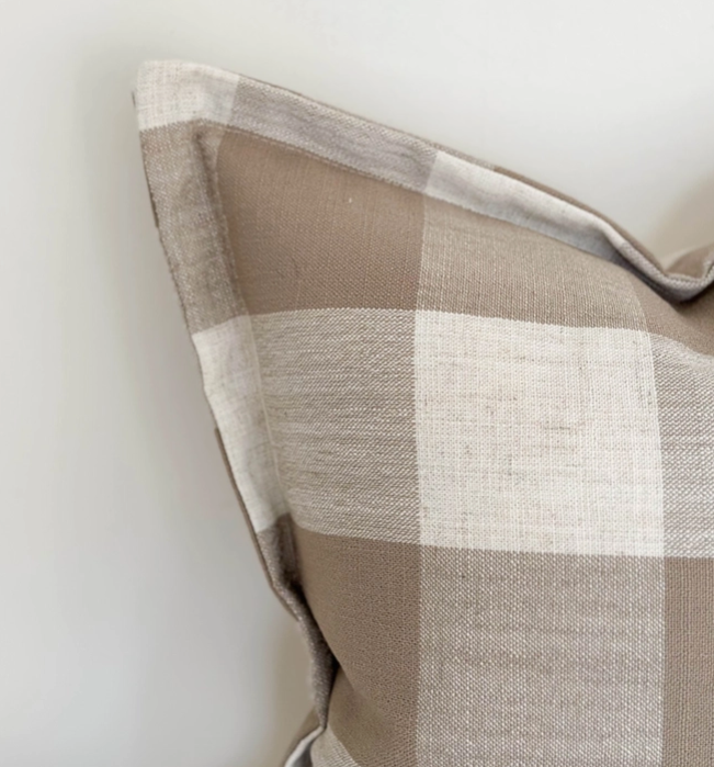 Large cushion with brown checker pattern