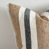 A stunning striped cushion in Navy, brown and Off white with a fringed edge detail.