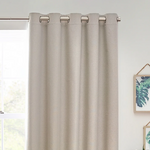 Beige curtain with grommets on a window with a light background