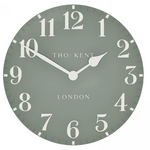 Round wall clock with white numbers and hands on a light gray background, featuring the brand 'Tho: Kent'.