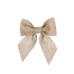 Beige bow on a white background