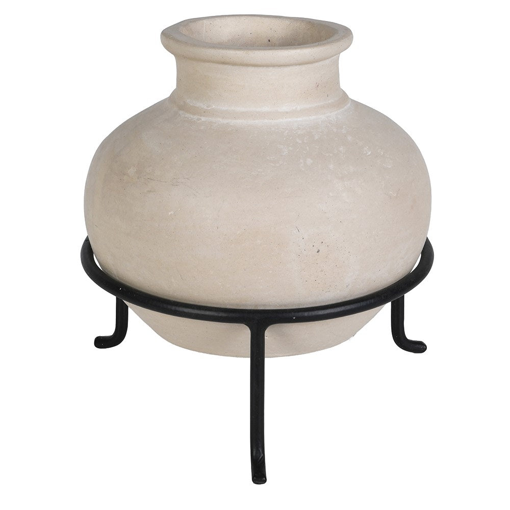 A round, textured beige ceramic pot with a flared rim, displayed on a black metal stand against a plain white background.